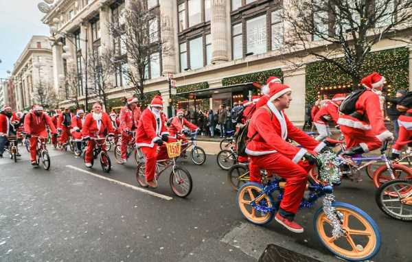 Бігуни та велосипедисти на вулицях Лондона